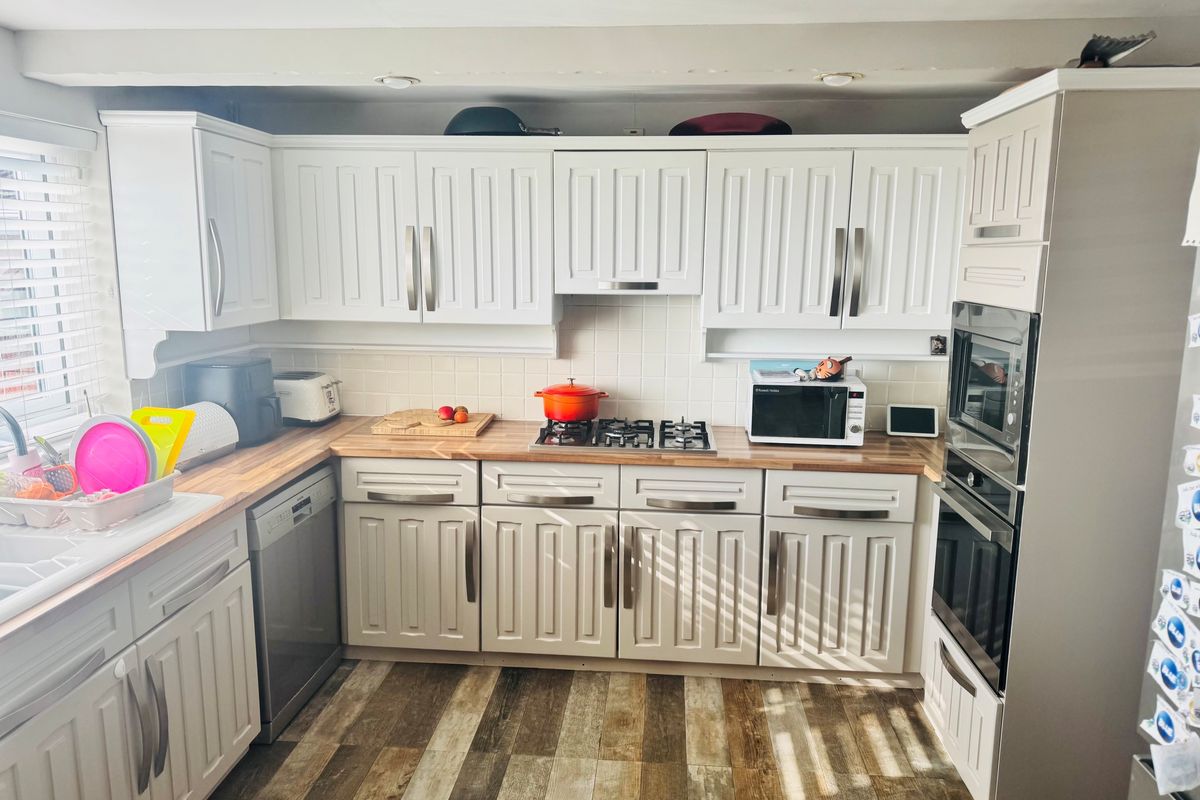 Before photo of a dated UK kitchen used to create an AI renovation mockup in TailoredQuote