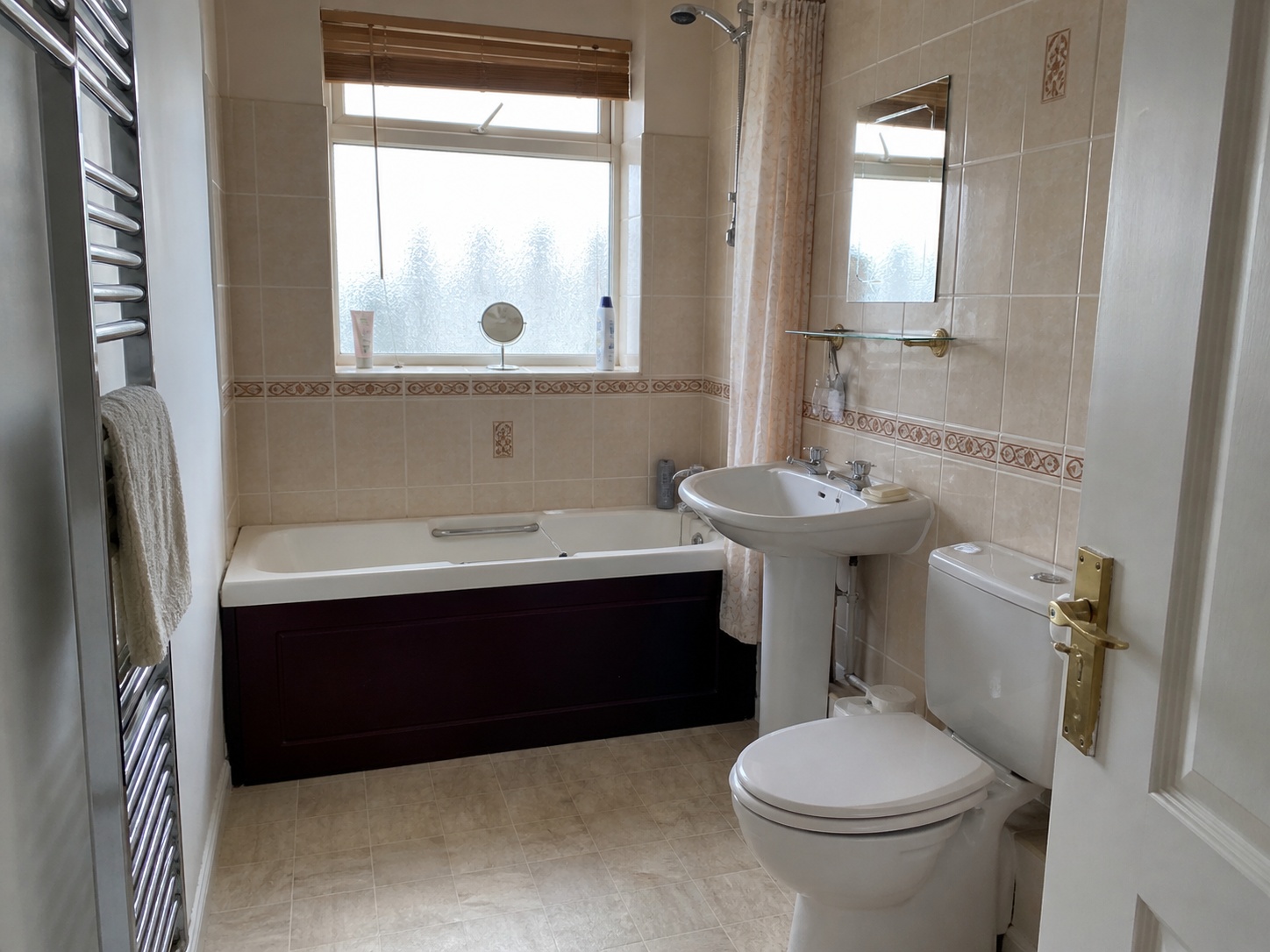 Existing bathroom with dated tiling and lighting before refit, before image of an AI mock-up