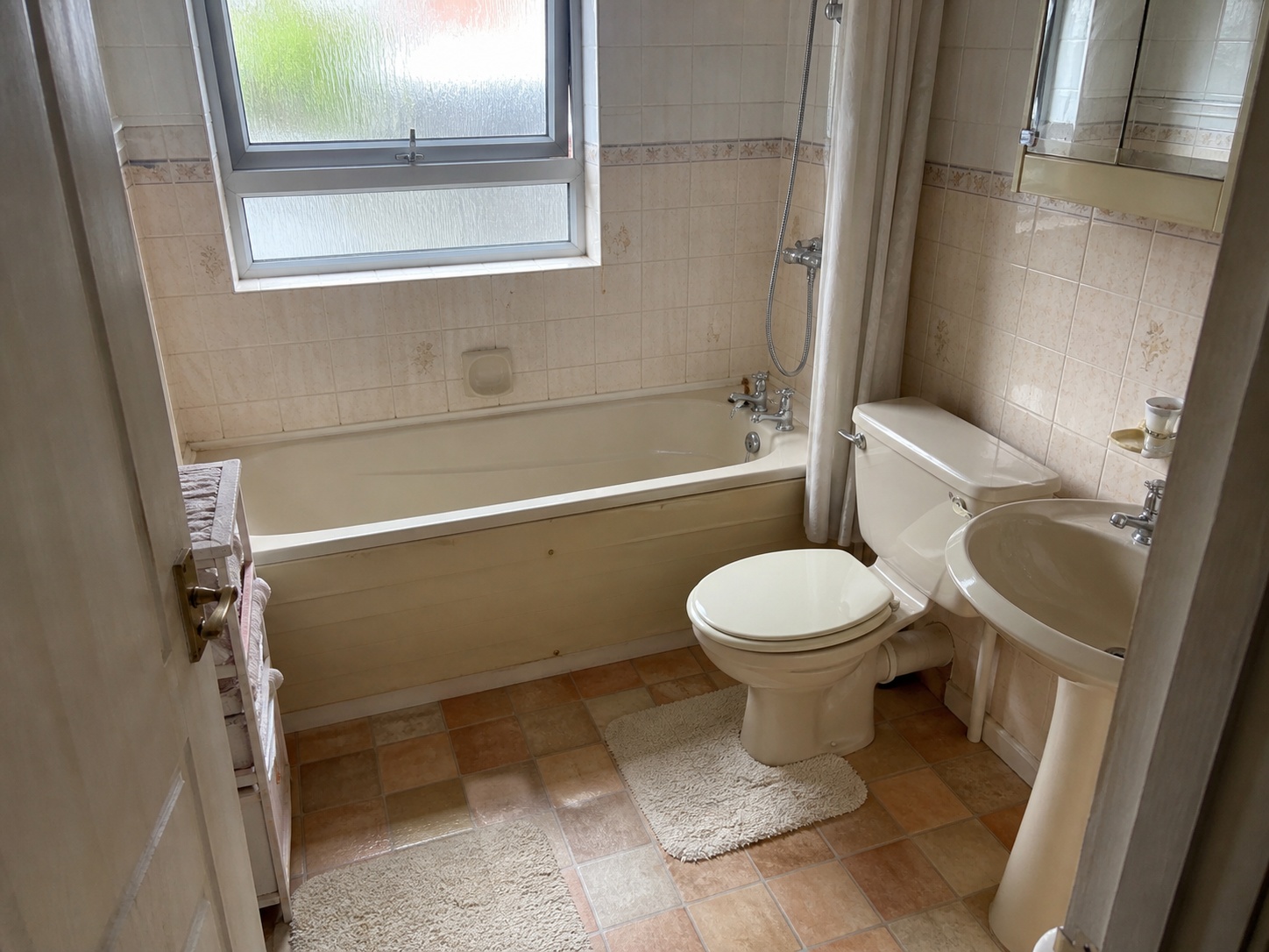 Illustrative AI mock-up of the same bathroom in a modern neutral finish with new vanity, screen and tiling
