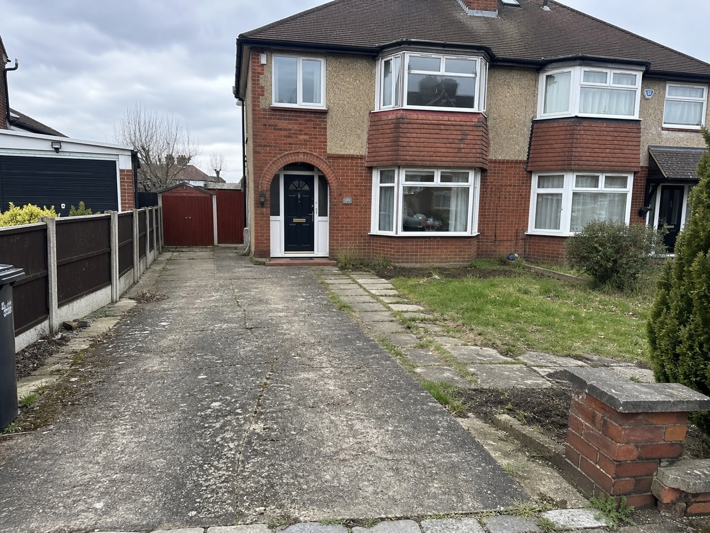 Original photograph of a worn UK driveway before resurfacing, used as the before image inside a TailoredQuote builder quote PDF