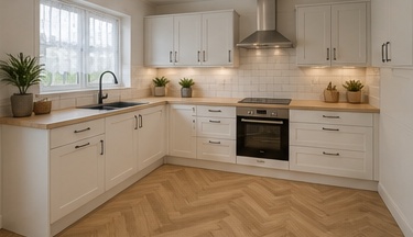 After image showing a bright white shaker kitchen with herringbone flooring for a TailoredQuote visual quote.